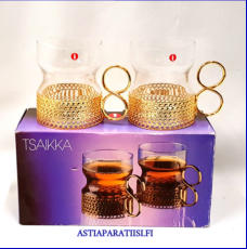 IITTALA,Tsaikka teelasi / gl�gimuki,v�rit�n lasi, kullanv�rinen pidike,Design:Timo Sarpaneva,Suunniteltu: 1965,Korkeus n.8 cm , Halkaisija n.6,7 cm 0 kpl, ( Tuote nro / Item #527J )